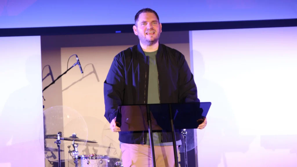 Three crosses on a hill at sunset representing Jesus’ sacrifice and the message The Love That Wouldn’t Turn Back from The Last Mile series.