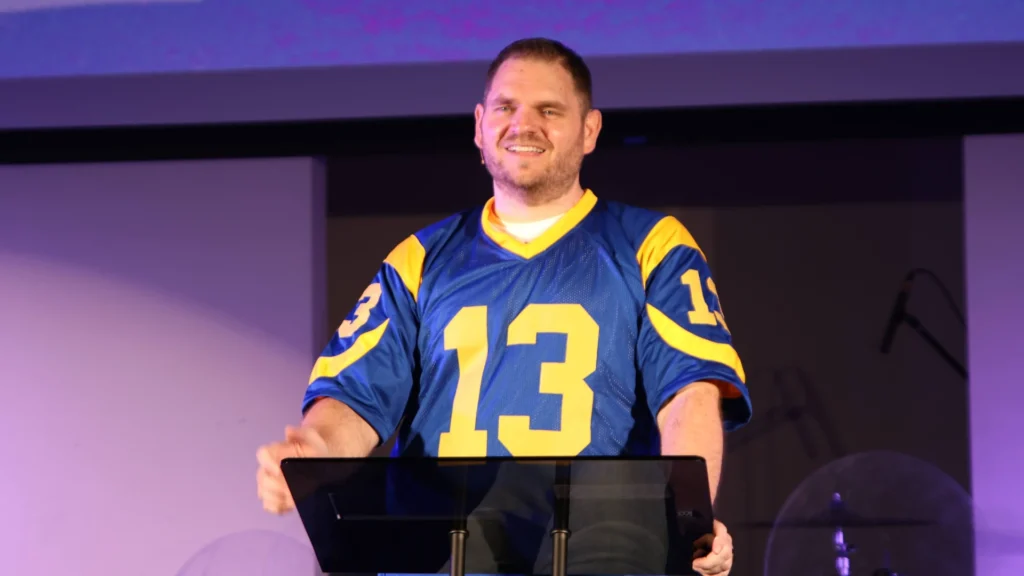 A worn jersey being replaced with a new one symbolizing transformation and new purpose in Christ from the message Your Story Isn’t Over.