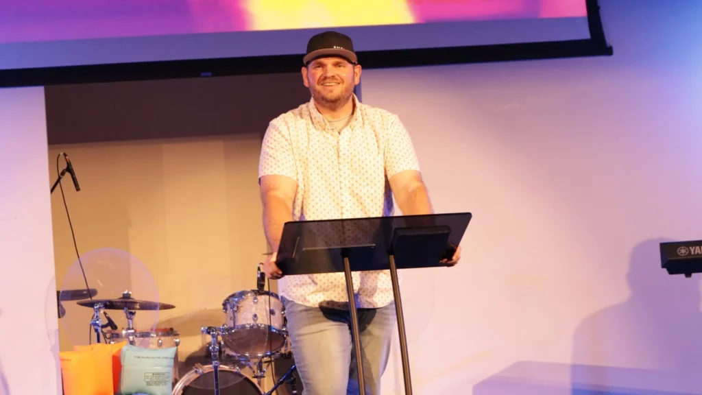 A child floating toward the deep end of a swimming pool wearing floaties, symbolizing spiritual drift and the importance of staying anchored in faith during the Summer Proof series.