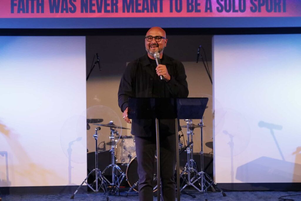Pastor Nathan Sheridan preaching "Step Out Together" at Anchor Church, teaching from 1 Samuel 14 about courage, shared faith, and obedience.